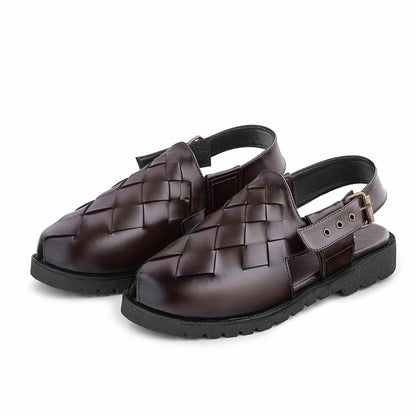 Pair of brown woven sandals on a white background