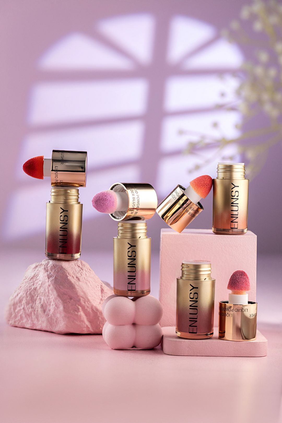 cosmetics photography  podium style group shot pink background