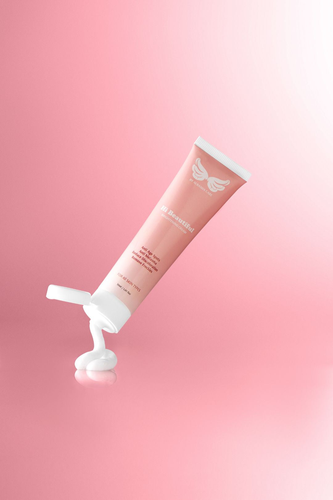 face wash action shot pink gradient background