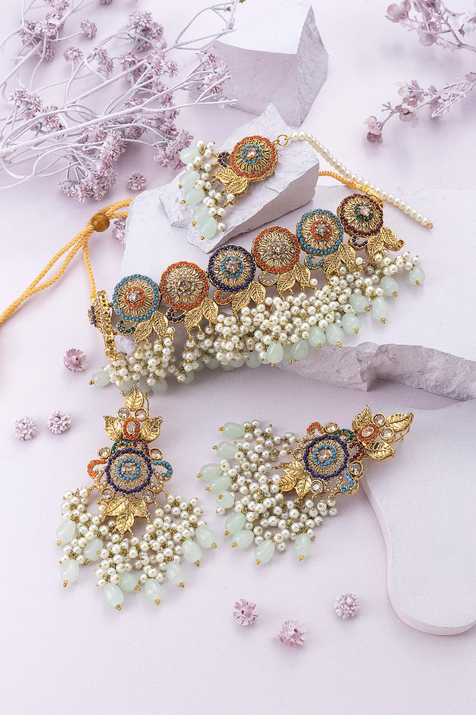 gold bridal jewelry set photography purple background