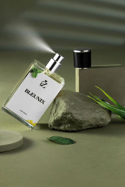 perfume bottle action shot on green background sprinkle effect