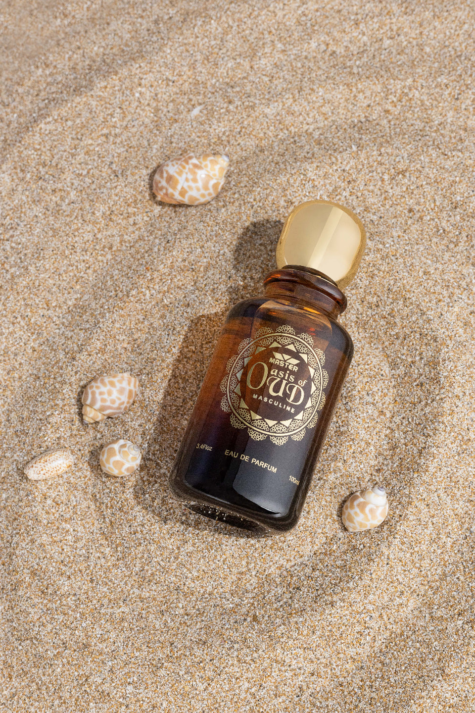 perfume bottle photography beige sand